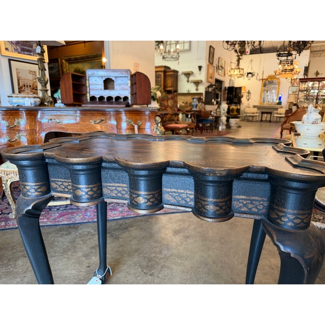 An exceptional English tea or accent table executed in the elegant Queen Anne style. This highly decorative antique...