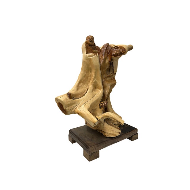 This exquisite root-carved sculpture highlights the natural warmth, flowing grain patterns, and distinctive burls of aged...