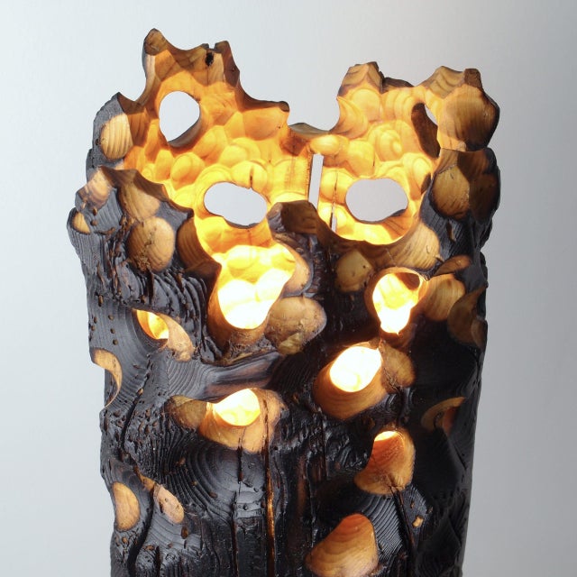 Torch Lighting is a hand-crafted table lamp from the Erosion Collection by Gabor Gobi, assembled from reclaimed pine and...