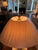 A Haig table lamp featuring a diamond-shaped brass-plated antique nickel column accented by solid brass detailing and a...