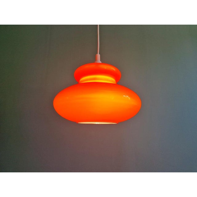 Space Age pendant light in orange opaline glass, 1960s-70s. The pendant has been rewired and is compatible with an E27 LED...