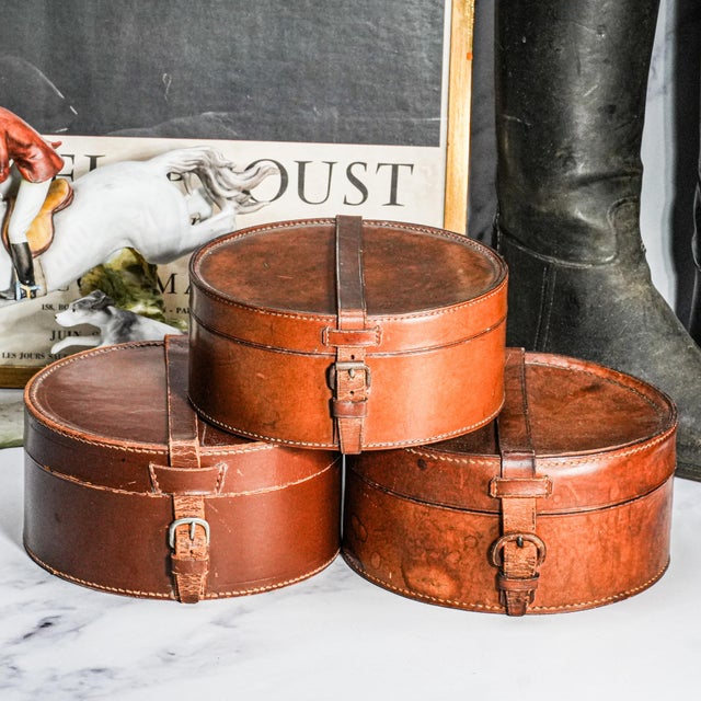 This striking collection of antique round collar boxes captures the quiet elegance and honest wear of early gentleman’s...
