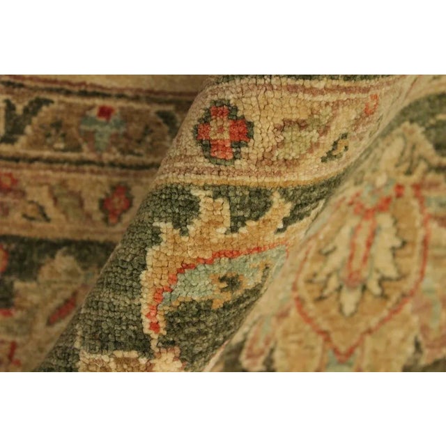 A Persian influenced Turkish hand knotted rug made by skilled artisans capable of creating the most exceptional vegetable...