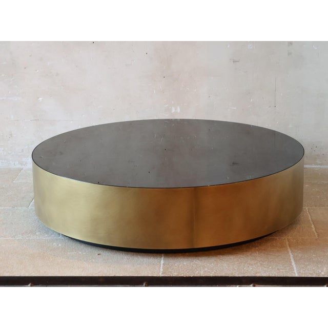 Round coffee table in clear Mid-Century style. This luxurious and minimalist design fits perfectly into a modern or...