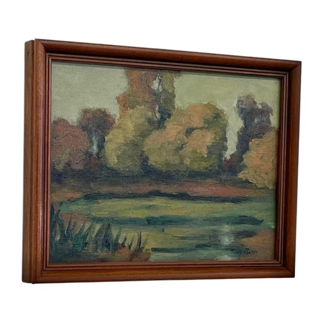 Signed landscape painting depicting a tranquil pond bordered by trees in muted green, ochre, and brown tones. Executed in...