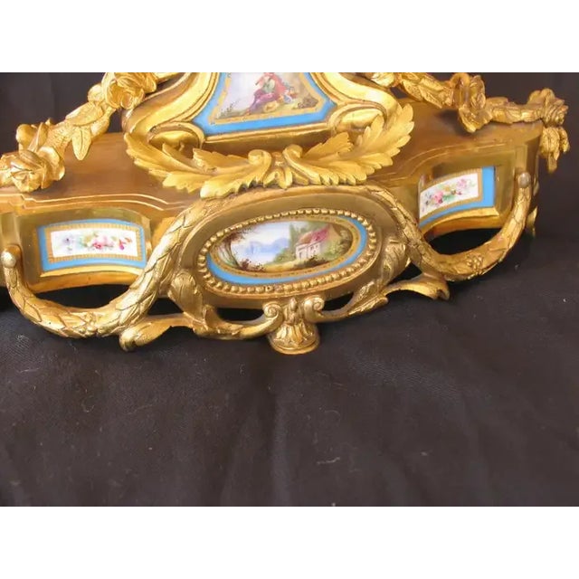 Unique French 19th century mantel clock. This exquisite mantel clock has a Sevres porcelain dial plate and other Sevres...