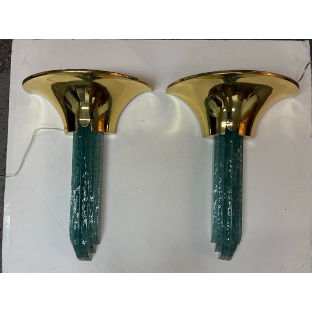 Design Plus Gallery presents a Pair of Purcell Brass + Aqua Glass Sconces by Karl Springer. Designed in the 1980s, the...
