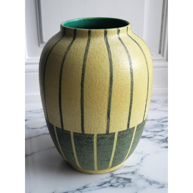 Magnificent, minimalist mid-century ceramic vase with a dignified, timelessly modern shape, featuring an elegant stripe...