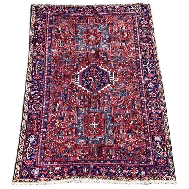 A beautiful antique Karadja rug, woven circa 1910. This rug features a geometrical 3 medallion design on a terracotta...