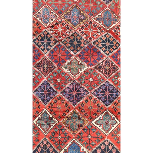 This amazing antique Persian Qashqai rug originates from the tribes of southwestern Iran and features a wonderful...