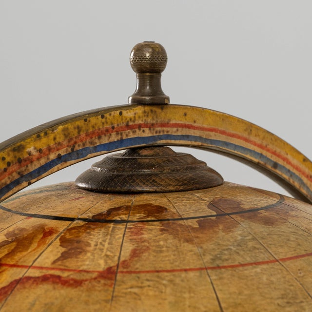 This 1970s French Baroque style globe bar cart combines decorative flair with playful functionality, serving as both a...