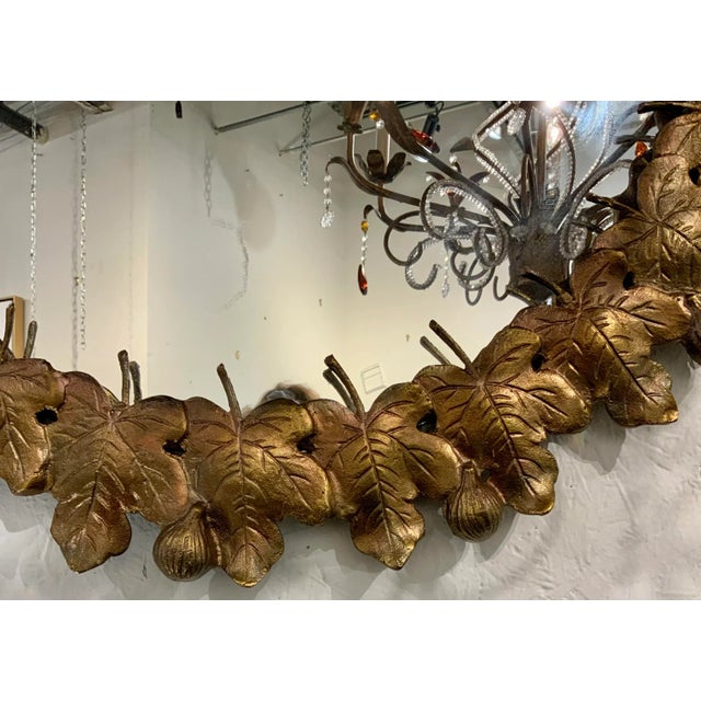 Stylish Currey & Co. Transitional Gold Finished Leaves Figuier Wall Mirror, round mirror, showroom floor sample