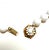 A lovely example of midcentury American costume jewelry, this vintage Miriam Haskell necklace pairs luminous white glass...