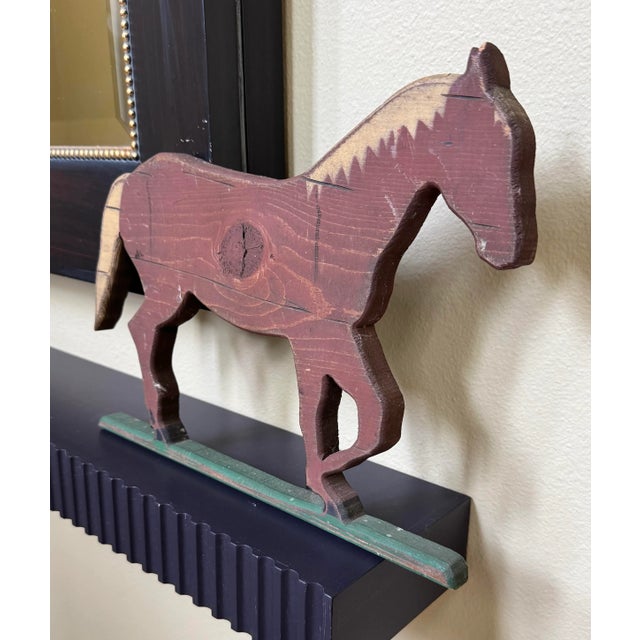In the Folk Art style this singular horse is fashioned and hand-cut out of a single piece of wood given the tree knot in...