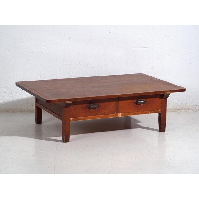 Antique Japanese low work table with side drawers, crafted in solid wood and dating to the early Showa period, circa...