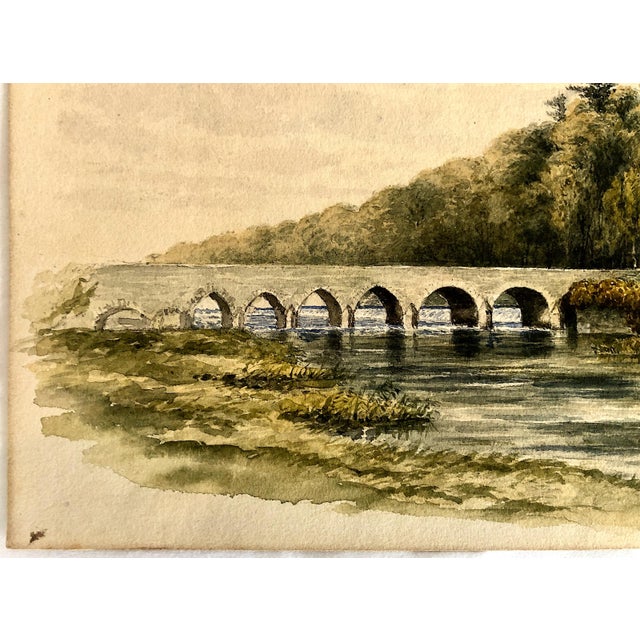This restful landscape is an early 19th-century watercolor depicting the historic Leixlip Bridge spanning the River Liffey...