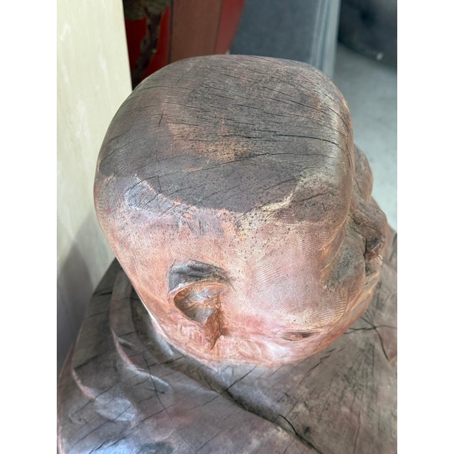 A wonderful carved wood Buddha sculpture carved out of a massive log. Not sure what the wood is, but it is extremely...