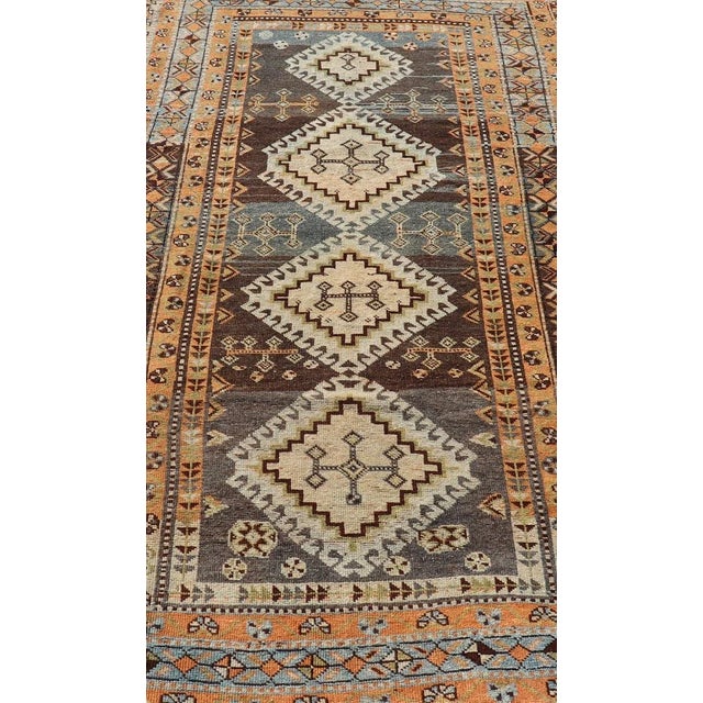 Measures: 4'5 x 8'8 Antique Persian Lori Rug with All-Over Geometric Tribal Medallion Design. Keivan Woven Arts / rug...