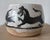 A highly expressive American studio pottery vessel from New York, decorated with a continuous procession of stylized...