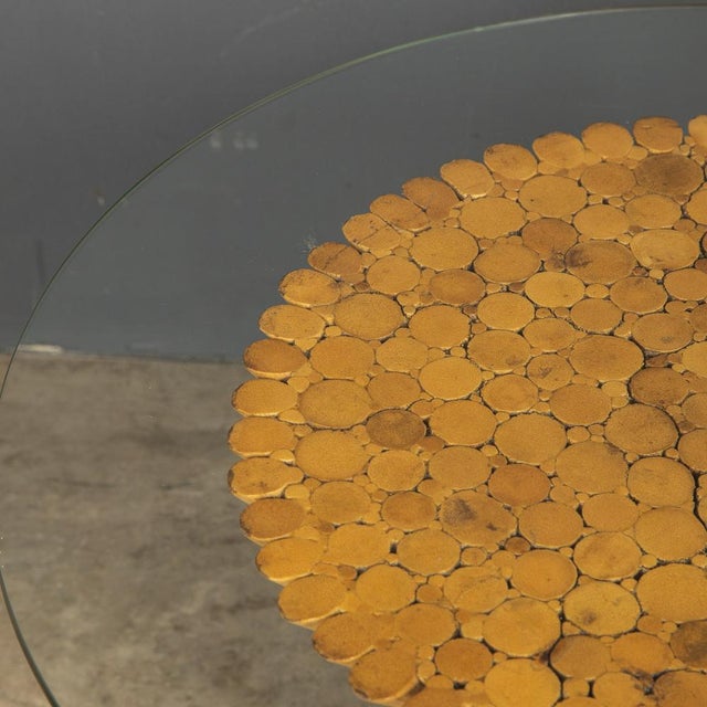 A stylish 1970s bamboo table made in the image of a wheatsheaf with a circular glass top by McGuire. In good condition -...