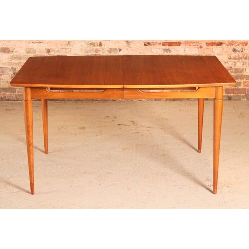 Mid Century extending walnut dining table, circa 1960s. Very unusual grooved top and sculptural legs. Solid wood...