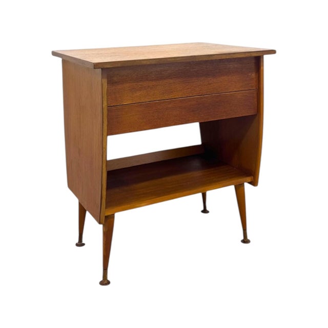 Capturing the quintessential warmth and clean lines of Mid-Century Modern design, this Italian-style accent table features...