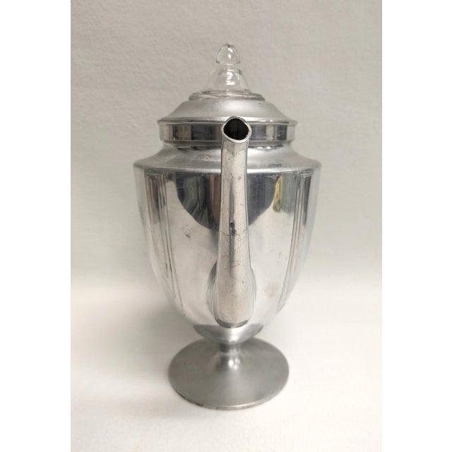 A stylish mid-century coffee server ready for your next party. The art deco coffee pot has a large bakelite handle,...