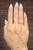 A striking 0.7-carat natural emerald-cut diamond takes center stage with its pristine white hue. Set in 14k yellow gold,...