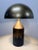 Very unique dome table lamp in an antique brass finish, featuring a distressed base that gives it a sophisticated...