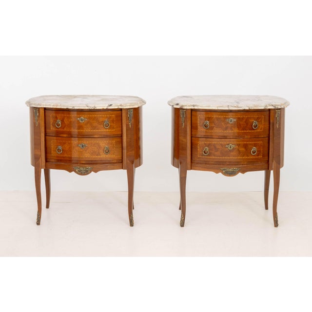 Pair of Louis XV Style Parquetry Commodes, each with marble top above two drawers atop cabriole legs. 32.5" H x 31.5" W x...