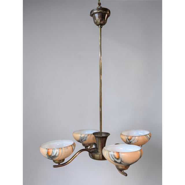 This four-branch ceiling lamp, designed by Paavo Tynell and manufactured by Oy Taito Ab at the turn of the 1940s and...