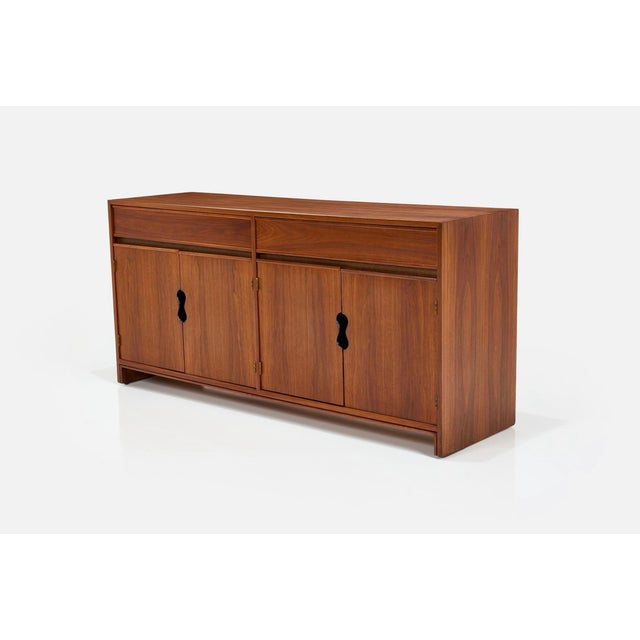 A beautiful credenza attributed to Brown Saltman and likely designed by Paul Laszlo. The cabinet has wonderful keyhole...