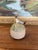 Charming handmade studio pottery incense holder featuring a whimsical seated figure perched atop a rounded base. The...