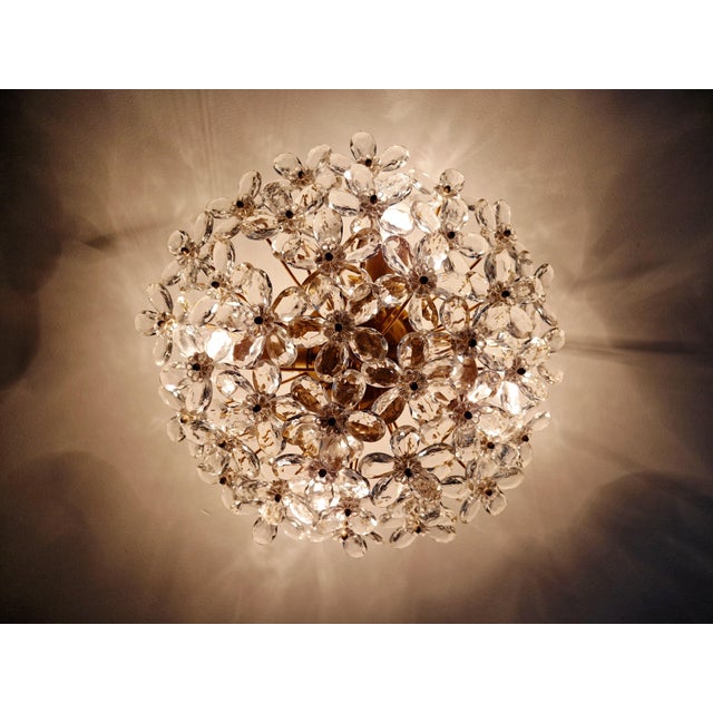 Large Italian ceiling light in gilt metal with Murano crystal flowers, 1970s. It has four light points compatible with E14...