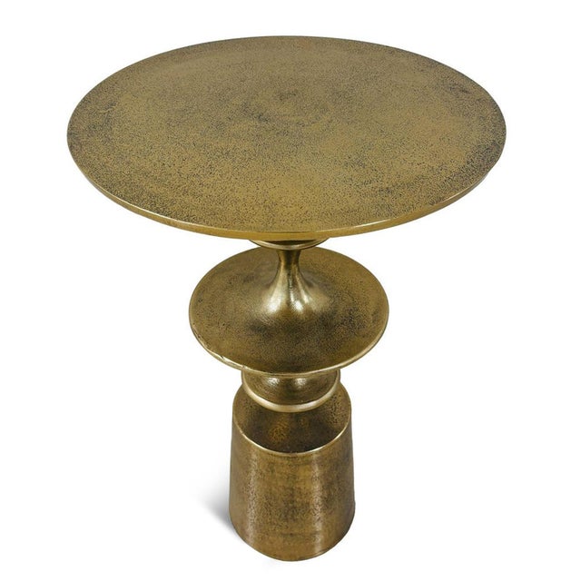 This side table brings sculptural character and sophistication to any space, featuring retro curved forms crafted from...