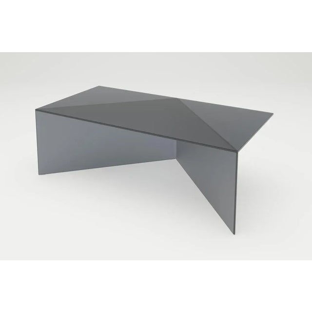 Black satin glass poly square coffe table by sebastian scherer. Dimensions: d120 x w30 x h40 cm. Materials: solid coloured...