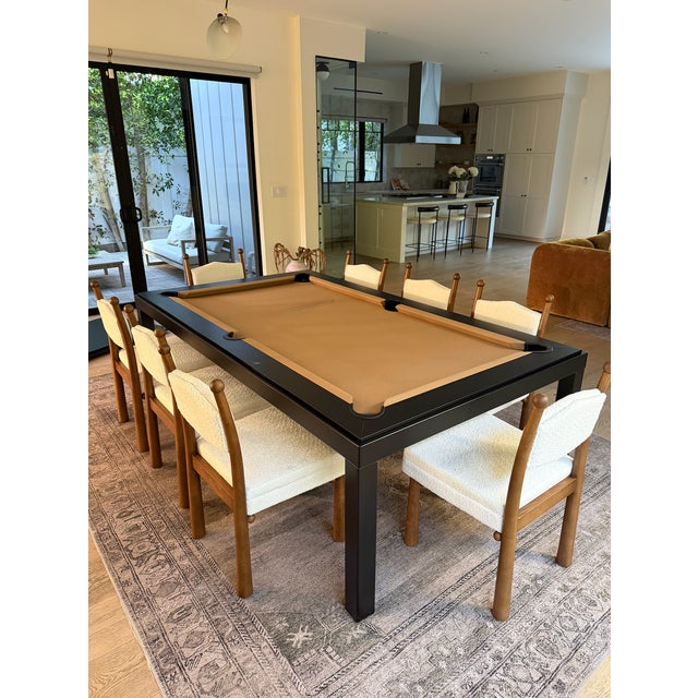 This custom-made Robertson Billiards & Spas dining pool table combines sleek design, functionality, and entertainment in...