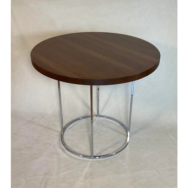 Designed by Milo Baughman, slender profile round modern side table or end table with chrome base and oak top. Simple yet...