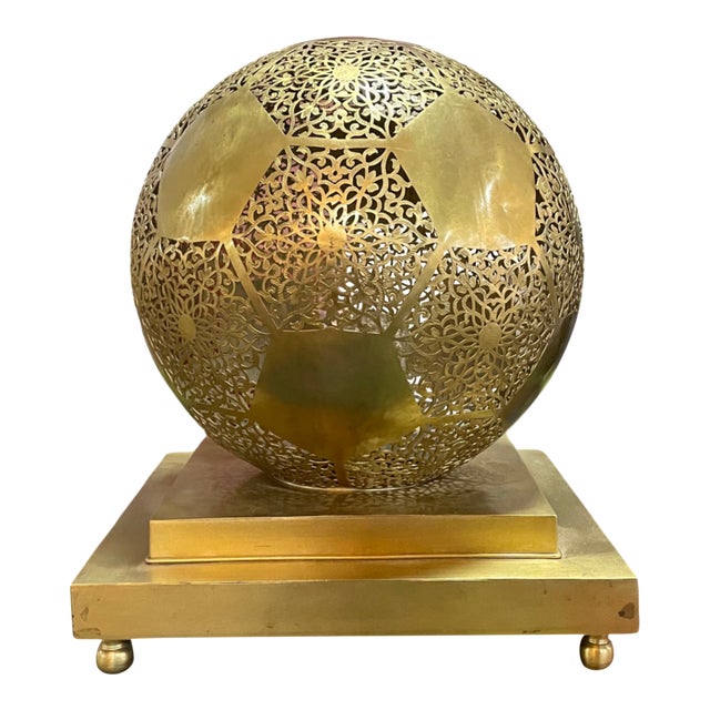 Illuminate your home with the poetic glow of this handmade Moroccan brass table lamp, a masterpiece of light and shadow....