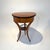 Small, round, three-legged Biedermeier sewing table with flap from Southern Germany around 1820. Cherry veneered and...