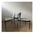 Rare set of 3 dining chairs with a striking black lacquered metal frame, seat and backrest upholstered with a light...