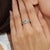 This elegant mid-20th-century style ring is crafted in 925 sterling silver and features a 0.58-carat natural emerald...