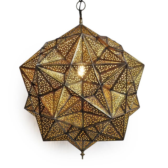 Vintage Indian brass pendant light is masterfully crafted, formed from a complex constellation of faceted, hand-pierced...