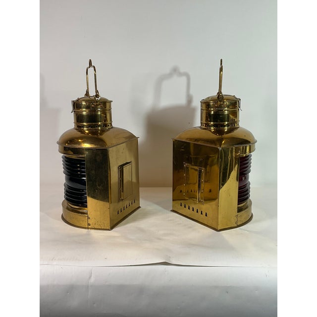 Highly polished solid brass ships port and starboard ships lanterns with fresnel glass lenses. Warm lacquer finish. With...