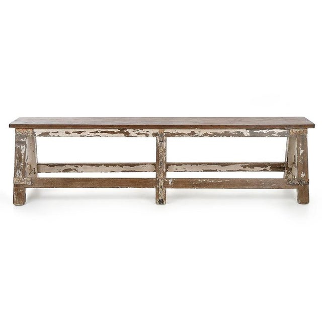 This patinated solid wood bench is distinguished by its simple lines and its old appearance, a legacy of long use which...