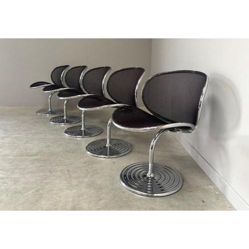 Remarks: Set of five Wilkhahn swivel dining chairs by Herbert Ohl, Germany 1980s Chrome frames with net upholstered seats....
