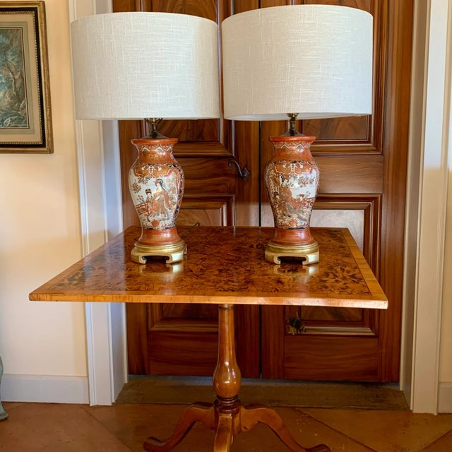 A pair of very finely decorated Kutani vase lamps, each with detailed court scenes alternating with intricate vignettes of...