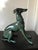 Three very decorative bronze statues sculptures of whippet dogs. Can be used as an coffee table when a glass top is put on...