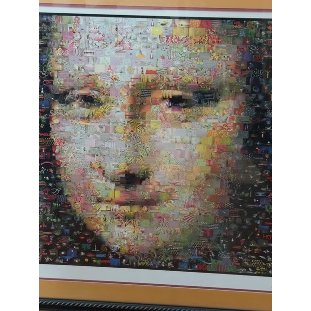 The composition reinterprets Leonardo da Vinci’s Mona Lisa through a Pop Art influenced photo mosaic structure, where the...