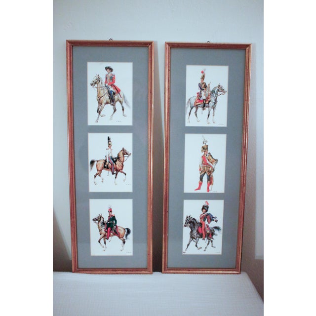 A regal set of nine signed color lithographs, featuring 18th and 19th-century military uniforms from various European...